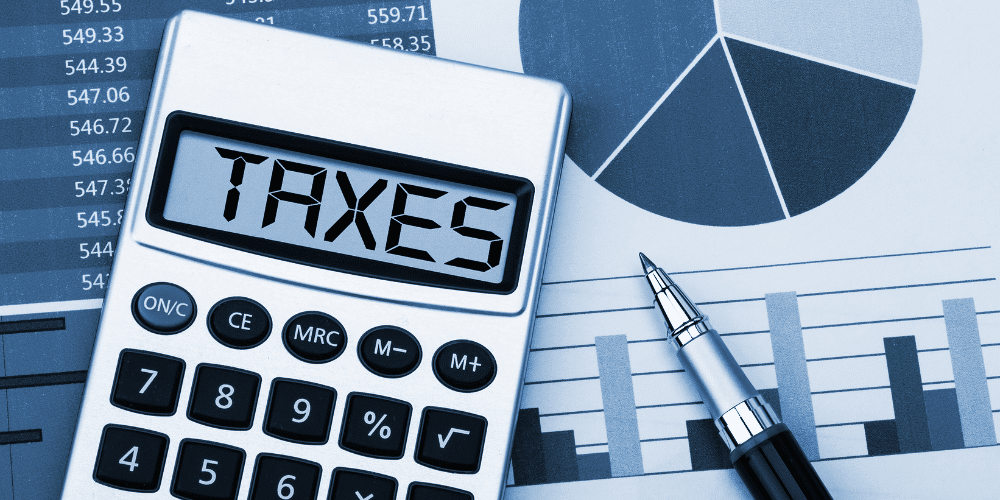 Calculator and graphs representing taxes of a startup