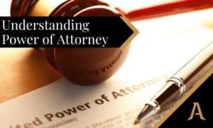 A Power of Attorney on a desk with a pen and gavel lying on top of it
