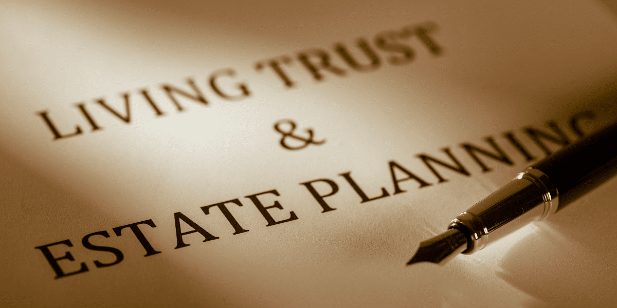 A document that says "Living Trust & Estate Planning" with a pen lying on it