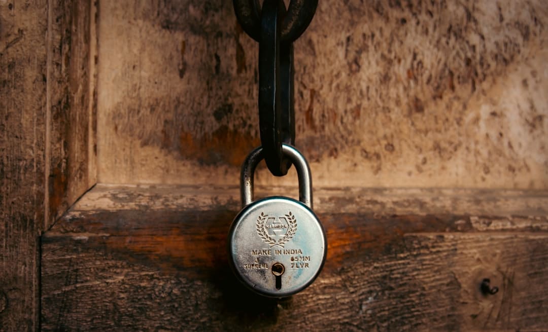 Close-up shot of a set of modern house keys resting on a stack of official legal documents, representing the closing of a ...