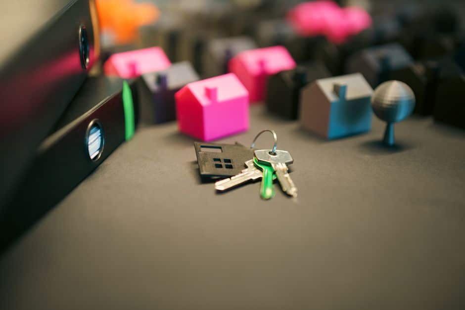 A professional and organized desk with real estate succession documents, a pen, and house keys, symbolizing the clear legal guidance offered for Louisiana property.